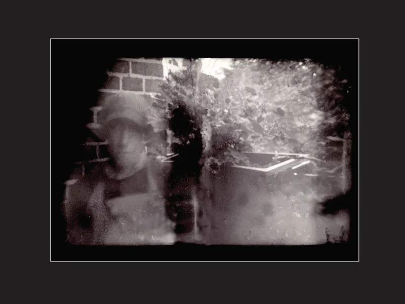 PINHOLE DEREK SELF PORTRAIT 1 AGAINST BLACK 